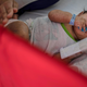 A child suffering from measles is treated at a hospital on May 4, 2019 in Manila, Philippines.